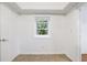 Tiled room featuring window and a white painted door at 838 Lake Hollow Sw Blvd, Marietta, GA 30064