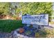 Spinnaker Cove sign with manicured landscaping in front of the private residences at 838 Lake Hollow Sw Blvd, Marietta, GA 30064