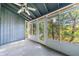 Bright sunroom with large screened windows, offering a serene view of surrounding greenery at 838 Lake Hollow Sw Blvd, Marietta, GA 30064