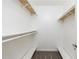 Walk-in closet with built-in shelving and ample storage space at 838 Lake Hollow Sw Blvd, Marietta, GA 30064
