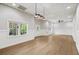 Spacious basement featuring hardwood floors, recessed lighting, and white walls and trim at 9310 Chapelwood Dr, Johns Creek, GA 30022