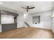Spacious finished basement area with hardwood floors, recessed lighting, and a wet bar area at 9310 Chapelwood Dr, Johns Creek, GA 30022