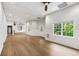 Spacious basement featuring hardwood floors, recessed lighting, and multiple entertaining spaces at 9310 Chapelwood Dr, Johns Creek, GA 30022