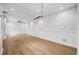 Spacious basement featuring hardwood floors, recessed lighting, and white walls and trim at 9310 Chapelwood Dr, Johns Creek, GA 30022