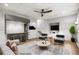 Staged basement design with wet bar, TV area, modern furniture, and recessed lighting at 9310 Chapelwood Dr, Johns Creek, GA 30022