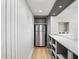 Basement wet bar area with stainless steel refrigerator and plenty of storage space at 9310 Chapelwood Dr, Johns Creek, GA 30022