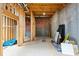 Unfinished basement space with exposed beams, concrete walls, and utility access at 9310 Chapelwood Dr, Johns Creek, GA 30022