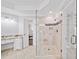 Bright bathroom showcasing shower with glass door, granite countertops, and natural light at 9310 Chapelwood Dr, Johns Creek, GA 30022