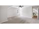 Large bedroom with a ceiling fan, neutral carpeting, and an ensuite bathroom at 9310 Chapelwood Dr, Johns Creek, GA 30022