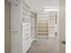 Spacious walk-in closet with custom shelving and ample storage at 9310 Chapelwood Dr, Johns Creek, GA 30022