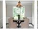 Bright dining room features a modern chandelier and a large window with views of mature trees at 9310 Chapelwood Dr, Johns Creek, GA 30022
