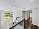 Grand foyer with hardwood floors, stairs, arched window above the front door, and decorative light fixture at 9310 Chapelwood Dr, Johns Creek, GA 30022