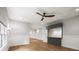 Hallway features a gray wet bar, wood flooring, high ceilings and ample natural light at 9310 Chapelwood Dr, Johns Creek, GA 30022
