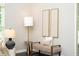 Stylish seating arrangement with art display, lamps, and decor creating a cozy nook at 9310 Chapelwood Dr, Johns Creek, GA 30022