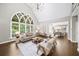 Bright living room with vaulted ceilings, large windows, and fireplace, creating a cozy atmosphere at 9310 Chapelwood Dr, Johns Creek, GA 30022
