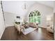 Bright living room with vaulted ceilings, large windows, and fireplace, creating a cozy atmosphere at 9310 Chapelwood Dr, Johns Creek, GA 30022