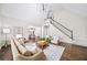 Bright living room with vaulted ceilings, large windows, and fireplace, creating a cozy atmosphere at 9310 Chapelwood Dr, Johns Creek, GA 30022