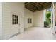 Covered back patio provides outdoor space with access to yard at 9310 Chapelwood Dr, Johns Creek, GA 30022
