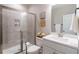 Tiled bathroom featuring a glass enclosed shower, a toilet, and a vanity with a sink and faucet at 1382 Doublegate Ne Dr, Atlanta, GA 30319