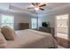 Spacious bedroom featuring wood-look furniture, neutral colors, and a lovely adjoining bathroom at 1382 Doublegate Ne Dr, Atlanta, GA 30319