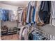 Walk-in closet offering ample storage with organized hanging space and shoe racks on a wood floor at 1382 Doublegate Ne Dr, Atlanta, GA 30319