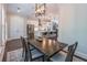 Open dining room view with pendant lighting and stainless steel kitchen appliances in the background at 1382 Doublegate Ne Dr, Atlanta, GA 30319