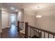 Hallway with dark hardwood floors, white trim, and doors leading to various rooms at 1382 Doublegate Ne Dr, Atlanta, GA 30319
