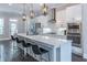 Bright, modern kitchen with stainless steel appliances, quartz countertops, and ample seating at the island at 1382 Doublegate Ne Dr, Atlanta, GA 30319