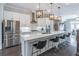 Open-concept kitchen with stainless steel appliances, a spacious island, and barstool seating at 1382 Doublegate Ne Dr, Atlanta, GA 30319
