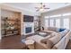 Comfortable living room featuring a fireplace, a large sectional couch and large windows at 1382 Doublegate Ne Dr, Atlanta, GA 30319