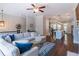 A stunning open-concept living space flows into the kitchen, featuring a plush sofa and hardwood floors at 1382 Doublegate Ne Dr, Atlanta, GA 30319