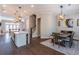 Open concept view from kitchen to dining and living room; wooden floors unify space at 1382 Doublegate Ne Dr, Atlanta, GA 30319