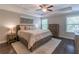 Serene main bedroom with tray ceiling, a king bed, and natural light from the windows at 1382 Doublegate Ne Dr, Atlanta, GA 30319