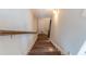 Stairway featuring hardwood steps, white walls, and a wood handrail leading to the next level at 1382 Doublegate Ne Dr, Atlanta, GA 30319