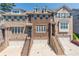 Beautiful brick townhouse with a two-car garage, landscaped front, and inviting staircase at 1382 Doublegate Ne Dr, Atlanta, GA 30319