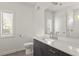 Modern bathroom featuring a mirror, natural light, and a vanity at 19 Moda Ln, Atlanta, GA 30316