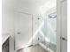 Modern bathroom with glass shower and a vanity with stone countertop at 19 Moda Ln, Atlanta, GA 30316