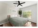 Serene bedroom with hardwood floors and a large window with natural light at 19 Moda Ln, Atlanta, GA 30316