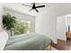 Bright bedroom with hardwood floors, a window view, and a comfortable-looking bed at 19 Moda Ln, Atlanta, GA 30316