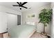 Cozy bedroom featuring a modern ceiling fan, neutral walls, and a sliding-door closet at 19 Moda Ln, Atlanta, GA 30316