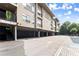 Apartment exterior showcasing covered parking, landscaping, and architecture at 19 Moda Ln, Atlanta, GA 30316