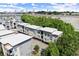 Modern townhome community featuring a contemporary design and landscaped surroundings with a downtown skyline in the distance at 19 Moda Ln, Atlanta, GA 30316