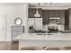 Modern kitchen with stainless steel appliances, a large island with seating and updated cabinetry and fixtures at 19 Moda Ln, Atlanta, GA 30316