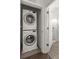 Washer and dryer located in a small laundry area next to the bathroom at 19 Moda Ln, Atlanta, GA 30316