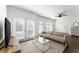 Cozy living room features a comfortable sofa, glass coffee table, and French doors at 19 Moda Ln, Atlanta, GA 30316