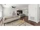 Open-concept living room with a modern sofa, stylish coffee table, and access to the kitchen at 19 Moda Ln, Atlanta, GA 30316