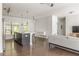 Open-concept living area with hardwood floors, a kitchen island with seating and modern stainless steel appliances at 19 Moda Ln, Atlanta, GA 30316