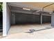 Covered parking area with designated parking spots and overhead lighting at 19 Moda Ln, Atlanta, GA 30316