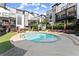 Relaxing pool area with lounge chairs surrounded by modern townhomes, perfect for outdoor enjoyment and socializing at 19 Moda Ln, Atlanta, GA 30316