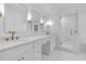 Elegant bathroom featuring double sinks, marble countertops, gold fixtures, and a glass enclosed shower at 4800 Timberland Sw Dr, Mableton, GA 30126